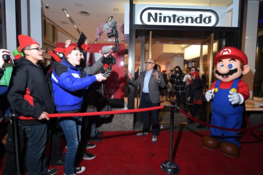 NEW YORK, NY - MARCH 02: In this photo provided by Nintendo of America, Doug Bowser, Senior Vice President Sales and Marketing, poses with eager fans lined up outside the Nintendo NY store on March 2, 2017 in New York City. (Photo by Michael Loccisano/Getty Images for Nintendo of America) *** Local Caption *** Doug Bowser